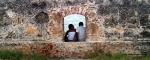 Lovers sitting in Cartagena's wall