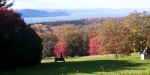 The Rockefeller's private golf course with a view of fall foliage and the Hudson River