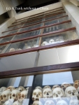 Skulls of the victims of the Killing Fields on display inside the memorial stupa